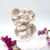 figura belen en resina blanca con decoracion de flores