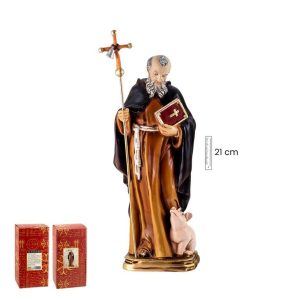 Figura de santo con una cruz en la mano derecha y un libro en la mano izquierda va vestido de marron y negro es anciano y tiene barba y pelo gris y a sus pies hay un cerdo pequeño de color rosa