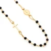 collar oro 18k y cuentas cristal negro detalle cruz y medalla milagrosa