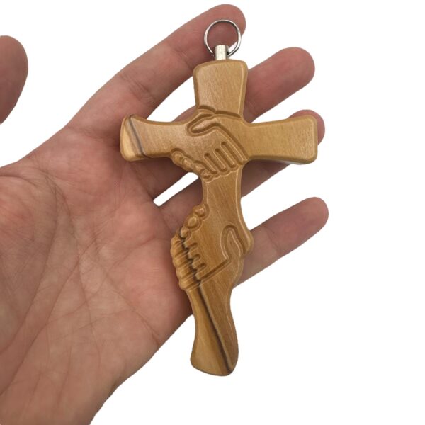 cruz amistad madera mano