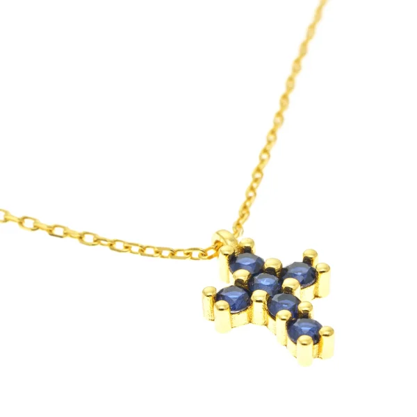 detalle cruz circonitas azules oro