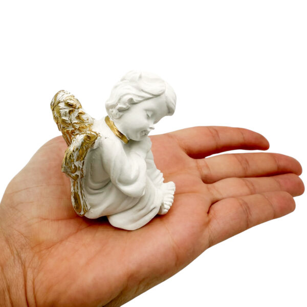 figura angel dormido mano