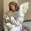 figura angel de la guarda arrullos sobre piedra