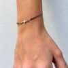 pulsera con circonitas plata baño oro negras