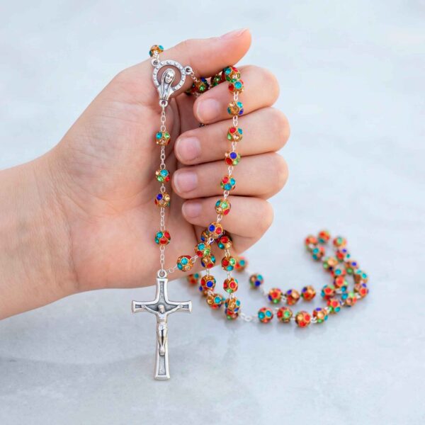 rosario strass con mano